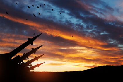 The missiles are aimed at the sky at sunset. Nuclear bomb, chemical weapons, missile defense.