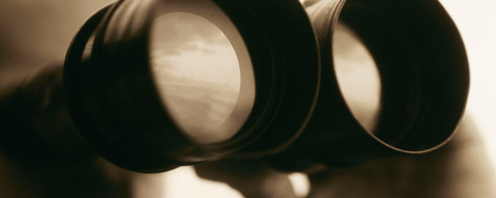 Man looking through binoculars